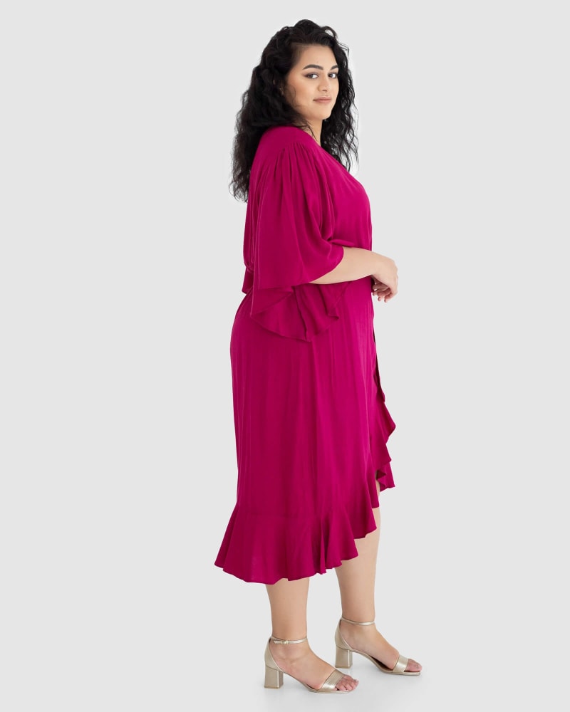 Side of a model wearing a size 12 Gabrielle Short Sleeve Wrap Dress in French Plum by Dani Marie US. | dia_product_style_image_id:233366